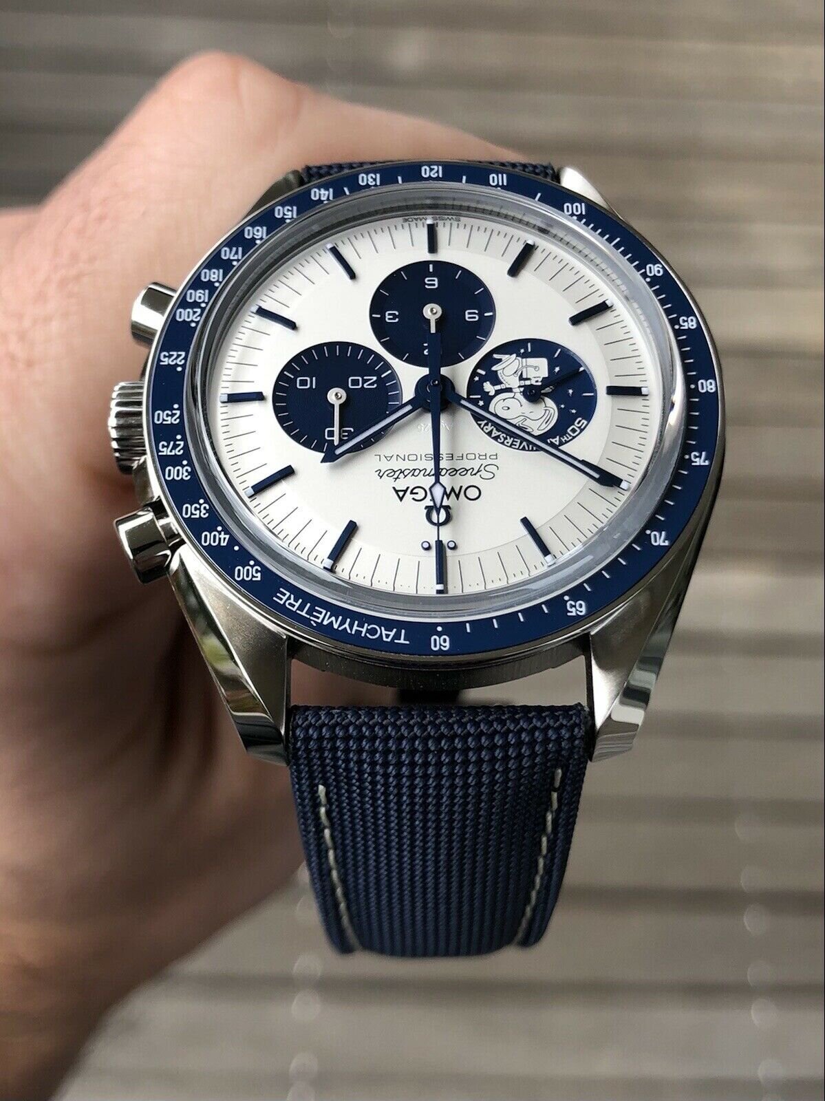 Omega speedmaster silver online snoopy award 50th anniversary